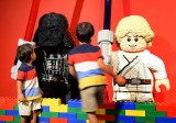 Young boys look at lego-made Darth Vader (L) and Luke Skywalker (R), characters in the US movie 