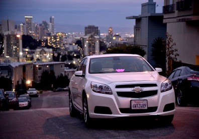 Lyft At Its San Francisco Headquarters Showcasing Lyft Cars, The Glowstache, The Lyft App, Lyft Passengers And Drivers
